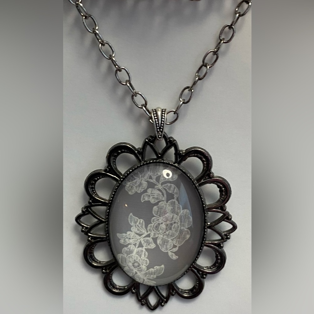 NEW  Gorgeous cameo necklace with silver (as shown) or gunmetal black chain. 18”